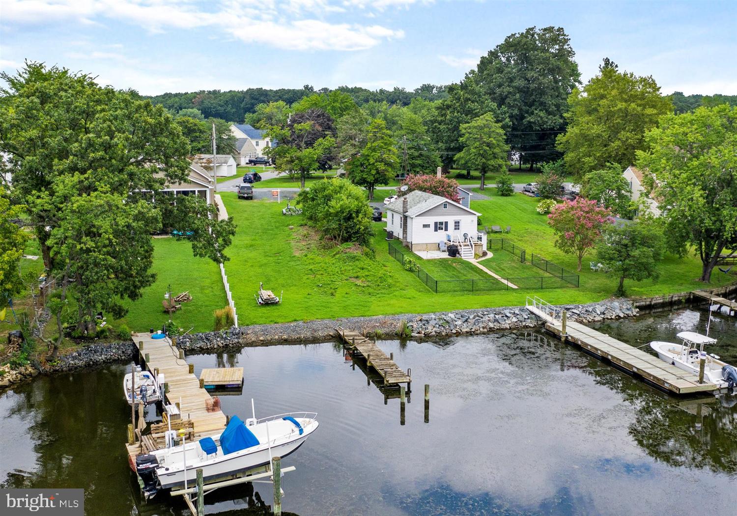 7801 North Cove Road Sparrows Point, MD 21219 - Photo 11 of 12 an aerial view of a house with a yard and lake view