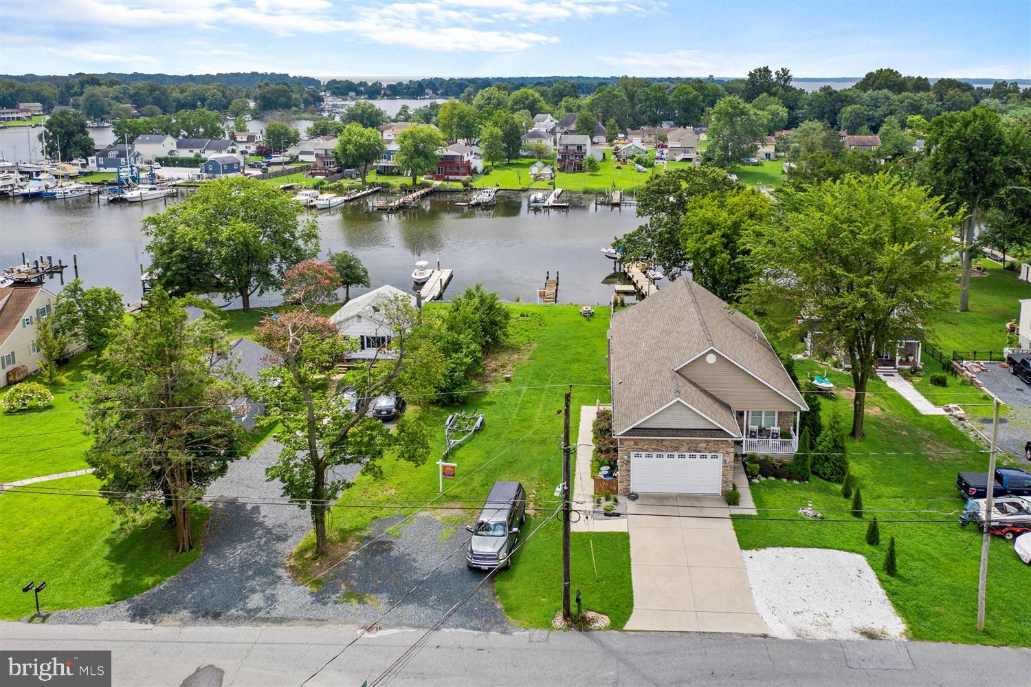 7801 North Cove Road Sparrows Point, MD 21219 - Photo 2 of 12 a view of a lake with a house