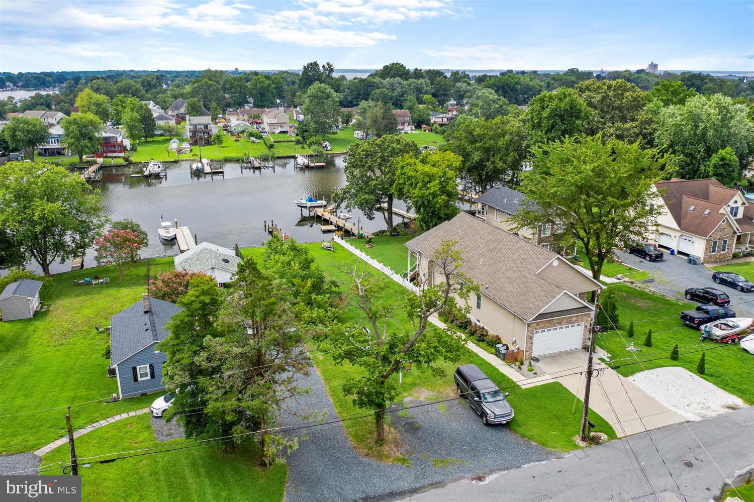 7801 North Cove Road Sparrows Point, MD 21219 - Photo 3 of 12 an aerial view of a house with a yard and lake view