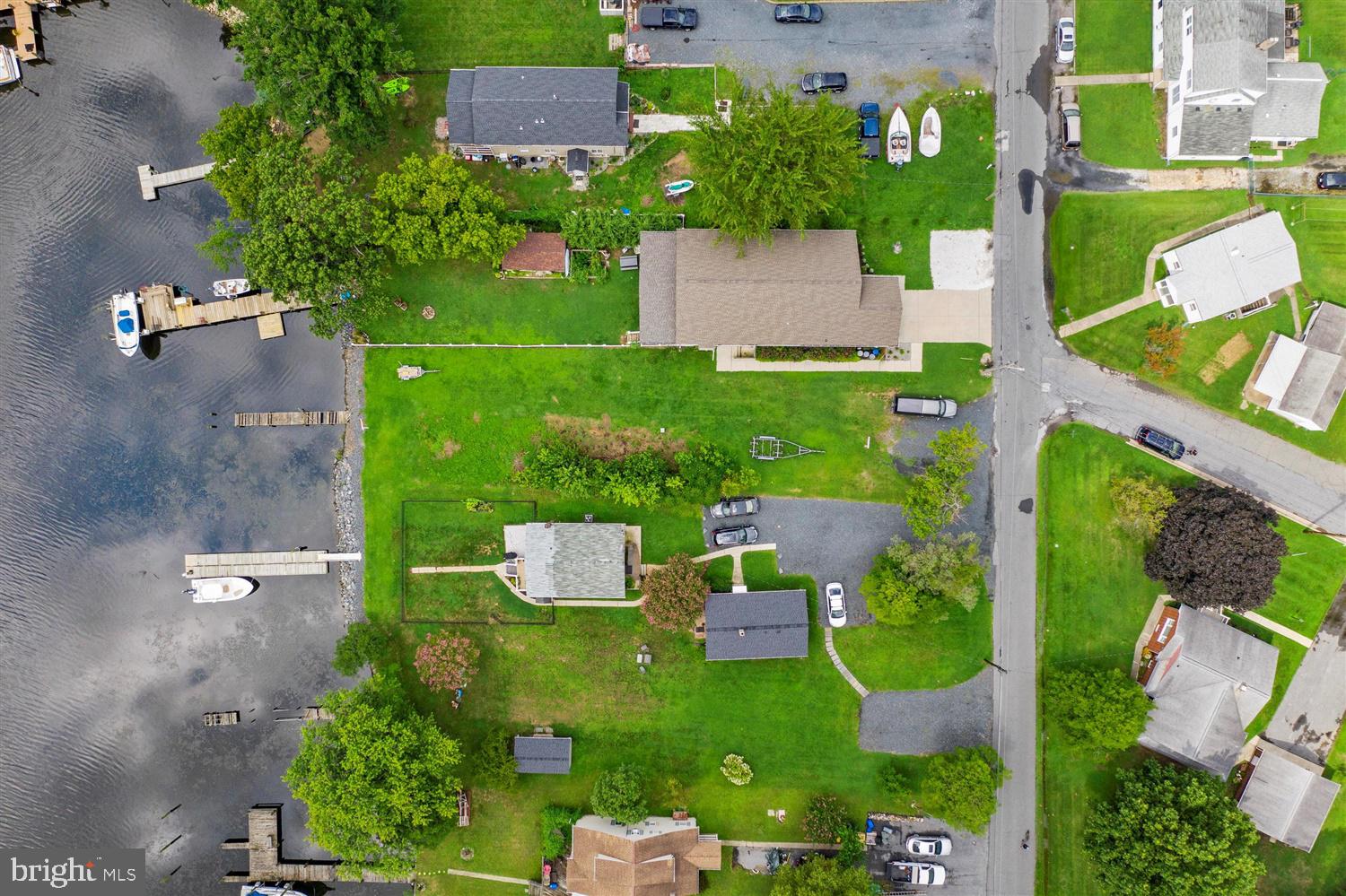 7801 North Cove Road Sparrows Point, MD 21219 - Photo 4 of 12 an aerial view of house with yard swimming pool and outdoor seating