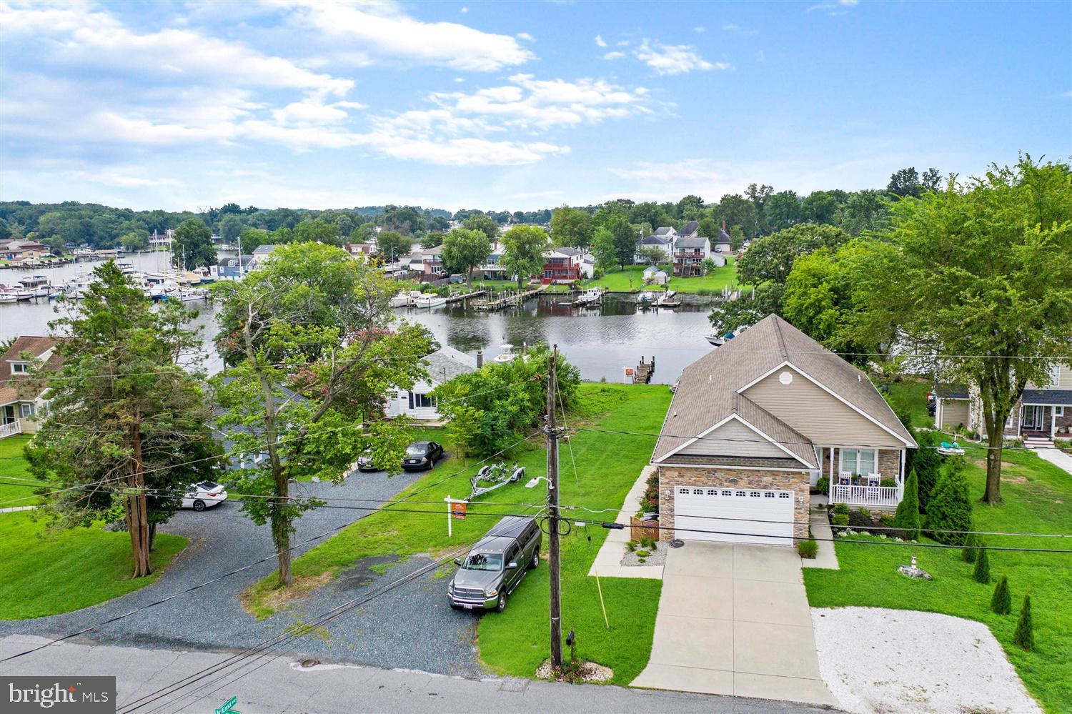 7801 North Cove Road Sparrows Point, MD 21219 - Photo 5 of 12 a house with river in front of it