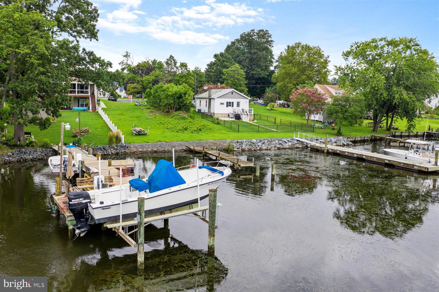 7801 North Cove Road Sparrows Point, MD 21219 - Photo 10 of 12 a view of a lake with a table and chairs
