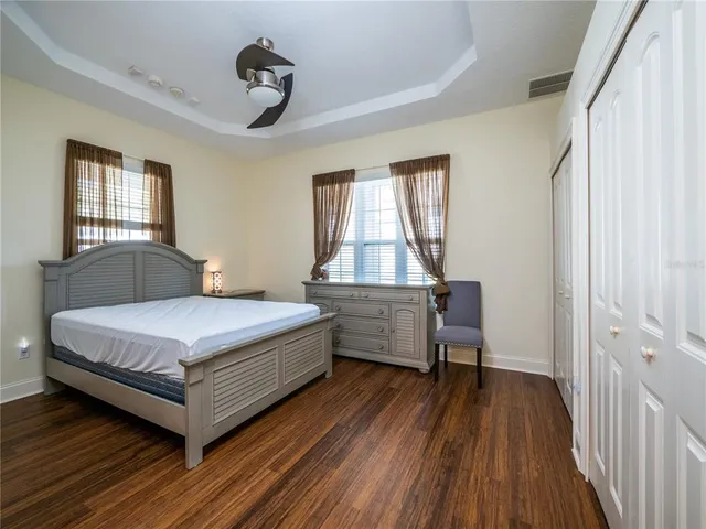 a bathroom with a granite countertop shower vanity and a sink