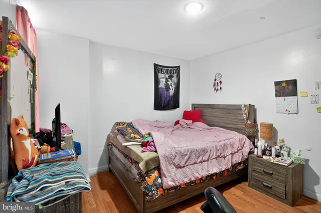 a bedroom with a bed and dresser