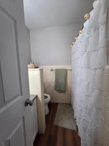 a bedroom with a bed and a lamp