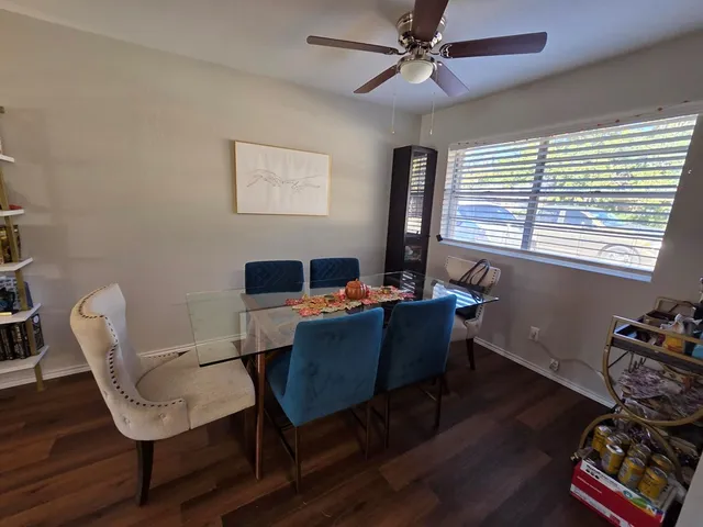 a kitchen with a sink a stove and cabinets