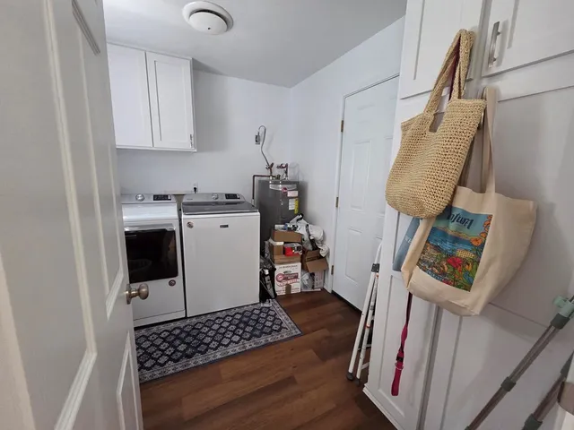 a living room with furniture a flat screen tv and a window