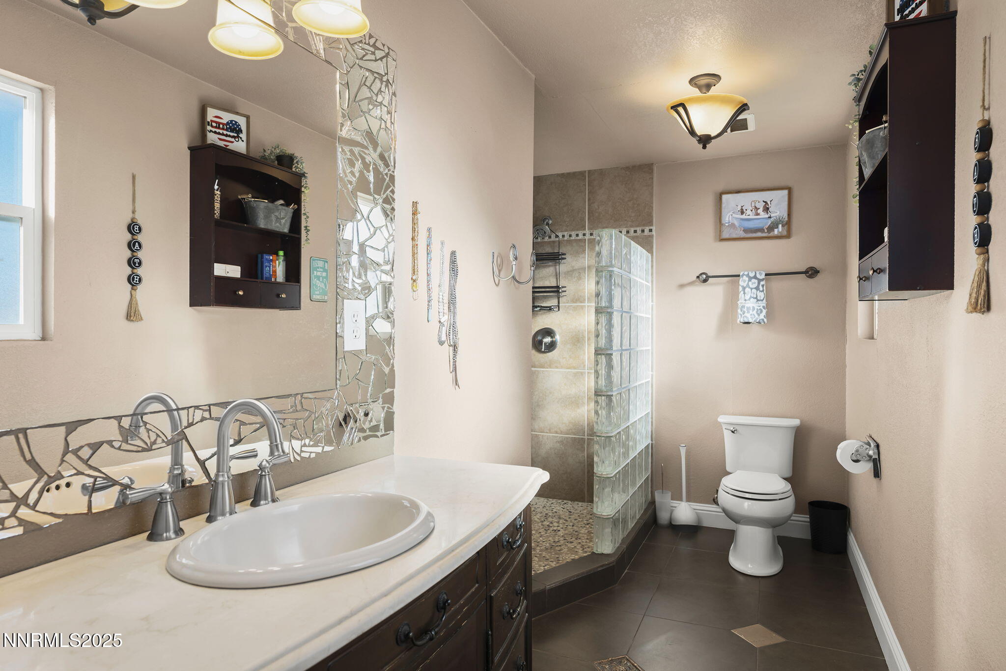 11600 Tupelo Street Reno, NV 89506 - Photo 12 of 23 a bathroom with a toilet sink and mirror