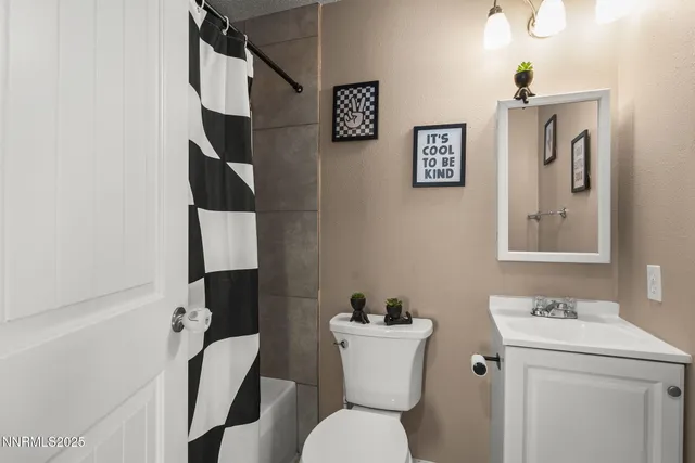 a view of a patio with a table and chairs