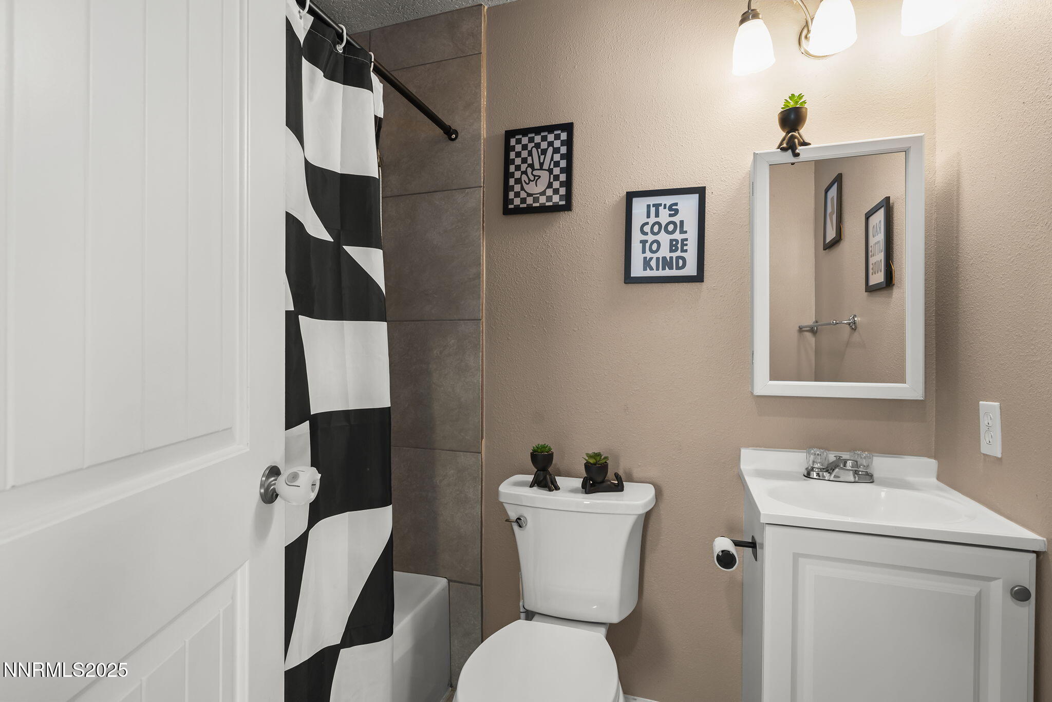 11600 Tupelo Street Reno, NV 89506 - Photo 15 of 23 a bathroom with a toilet sink and mirror