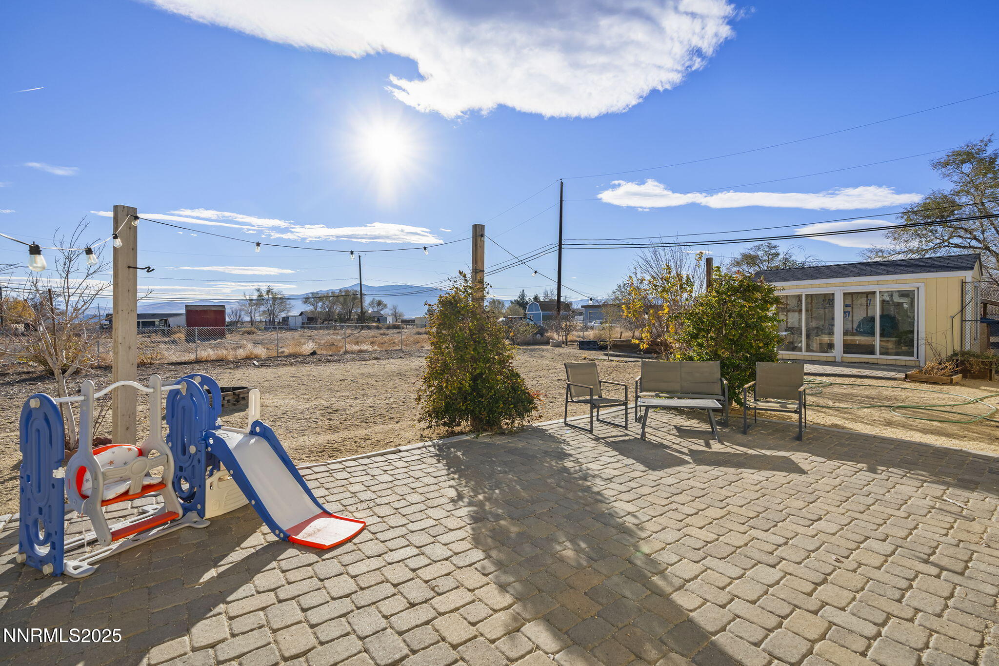 11600 Tupelo Street Reno, NV 89506 - Photo 16 of 23 a view of a patio with a table and chairs