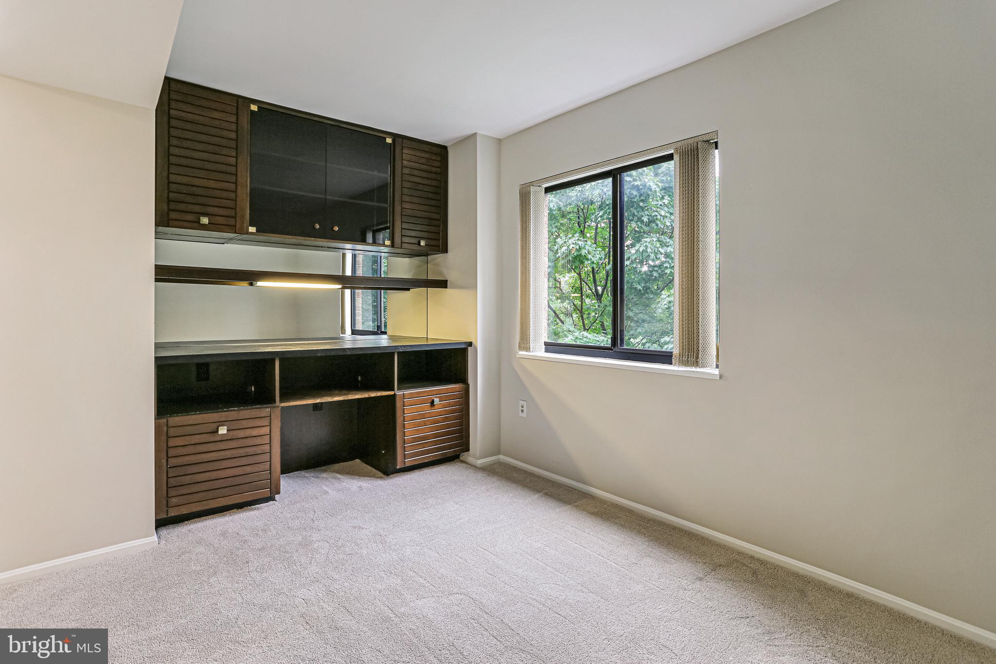 15101 Interlachen Drive, Unit 1504 Silver Spring, MD 20906 - Photo 13 of 37 Den with Built In cabinery