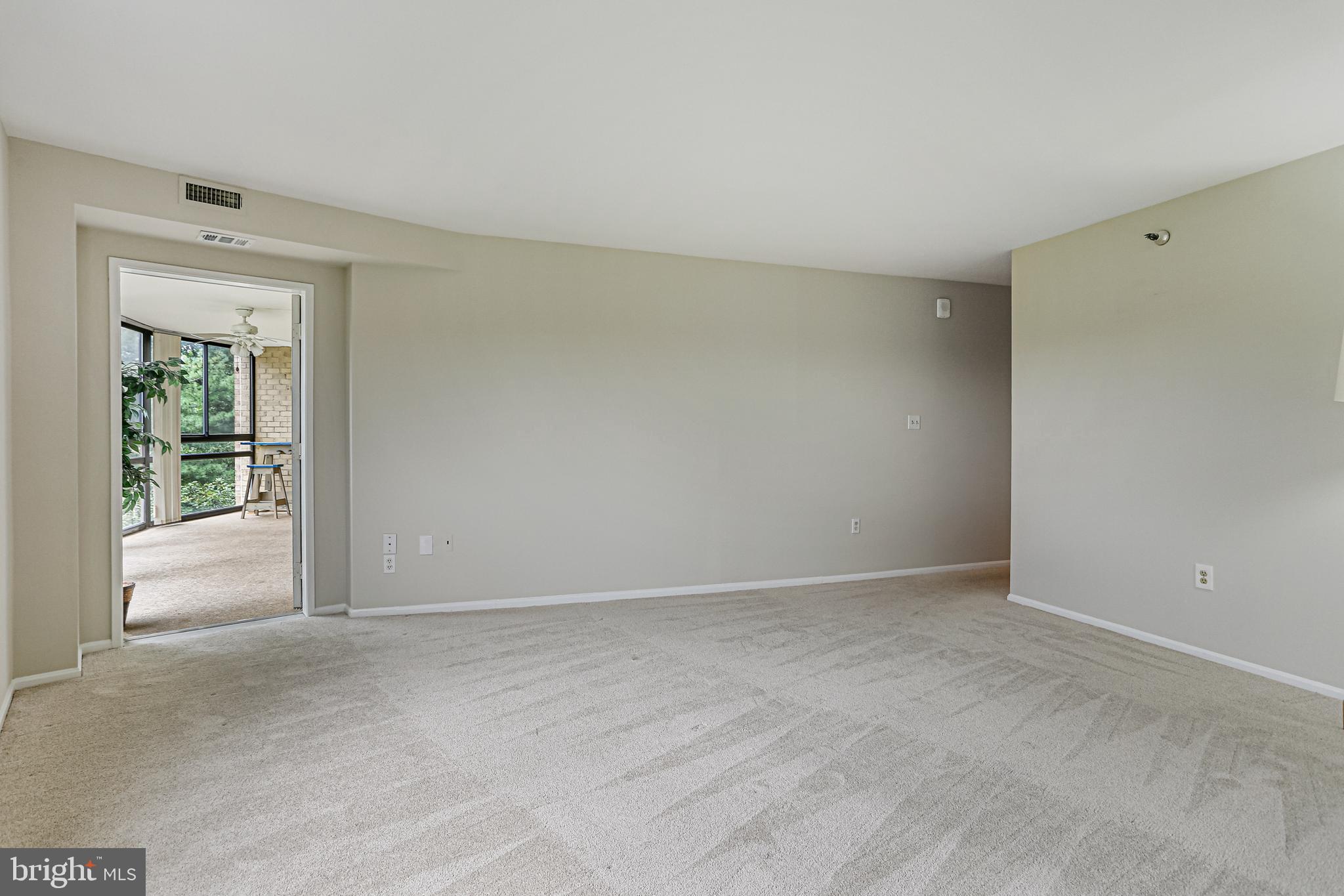 15101 Interlachen Drive, Unit 1504 Silver Spring, MD 20906 - Photo 23 of 37 Primary Bedroom with entrance to sunroom