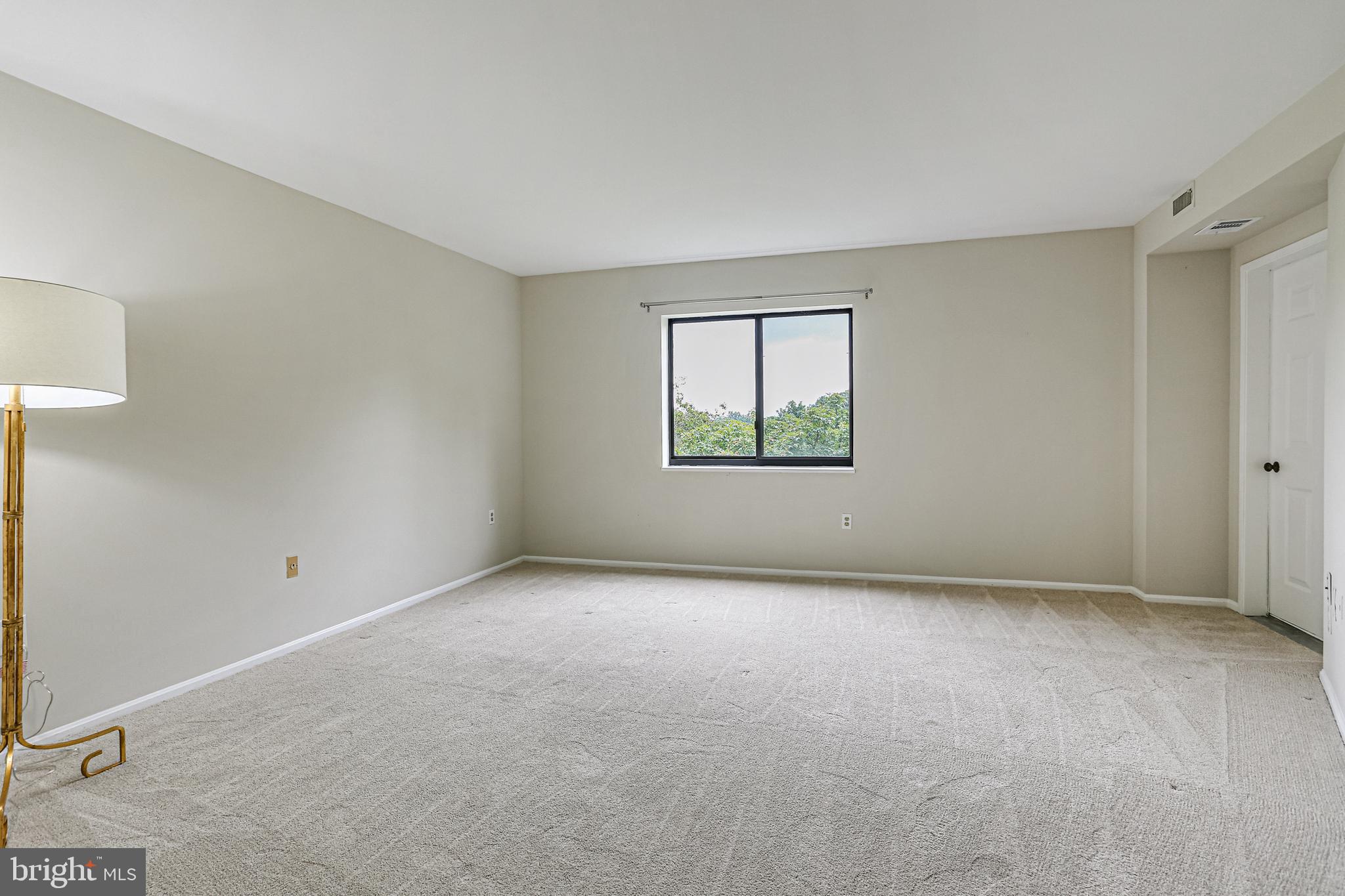 15101 Interlachen Drive, Unit 1504 Silver Spring, MD 20906 - Photo 24 of 37 Primary Bedroom with entrance to sunroom
