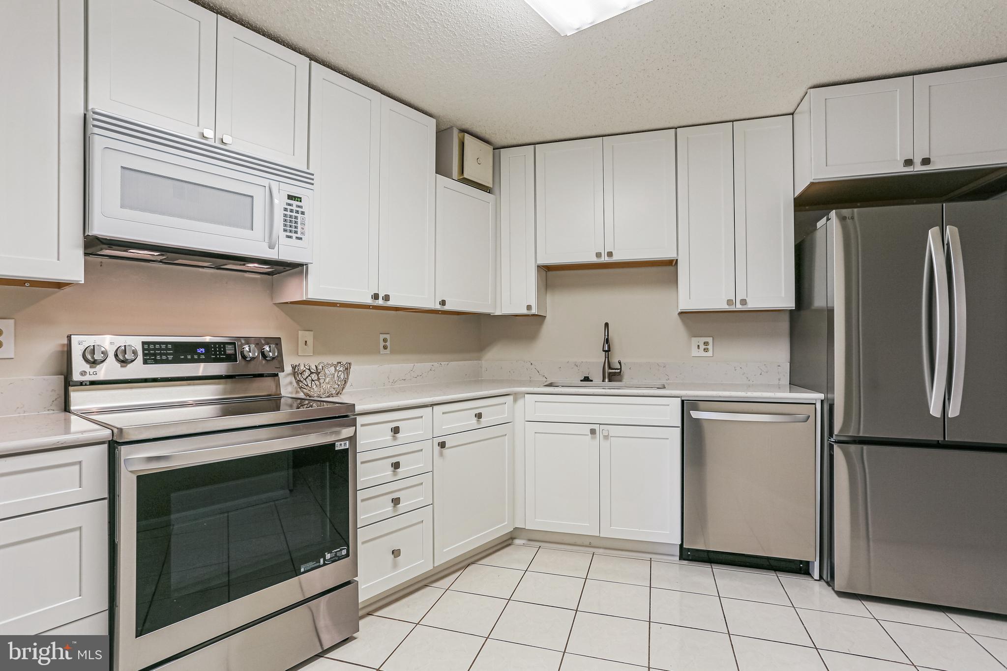 15101 Interlachen Drive, Unit 1504 Silver Spring, MD 20906 - Photo 7 of 37 New kitchen with all new everything.