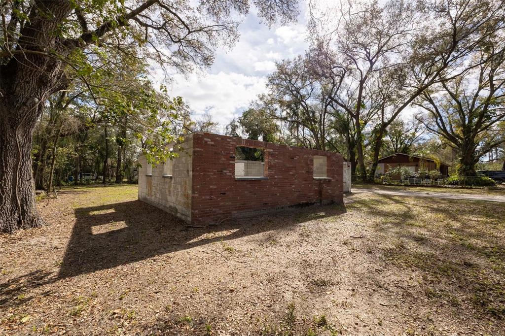 5515 North Falkenburg Road Tampa, FL 33610 - Photo 5 of 8 a view of a yard with a tree and snow