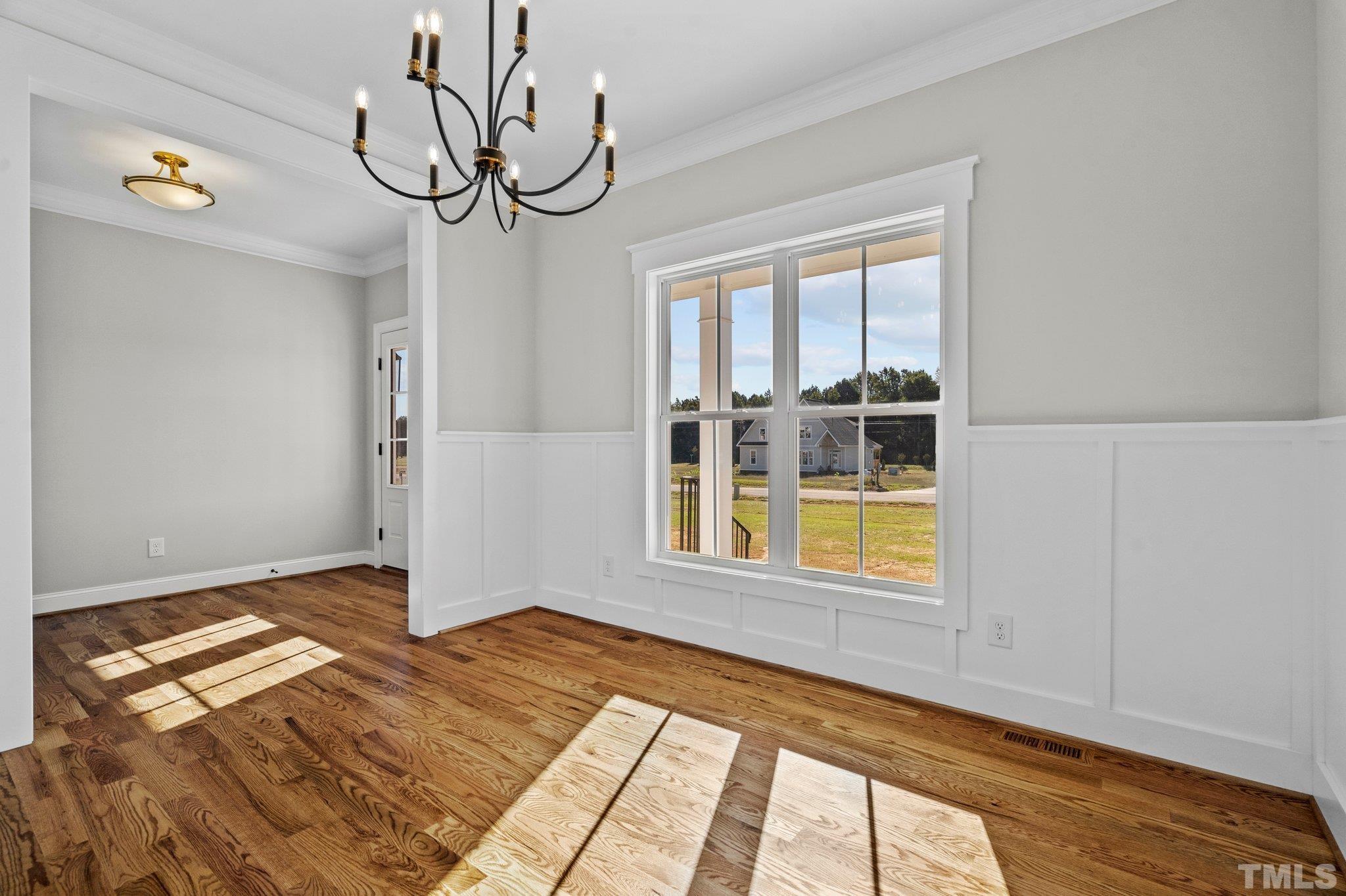 5901 Harvest Rdg Road Battleboro, NC 27809 - Photo 15 of 33 a view of an empty room with window and wooden floor