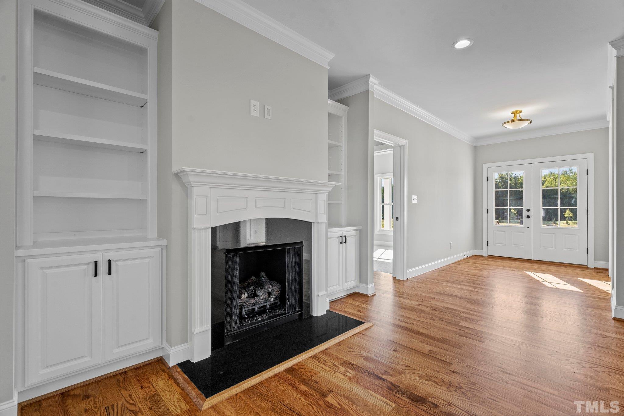 5901 Harvest Rdg Road Battleboro, NC 27809 - Photo 17 of 33 a view of a livingroom with a fireplace wooden floor and window
