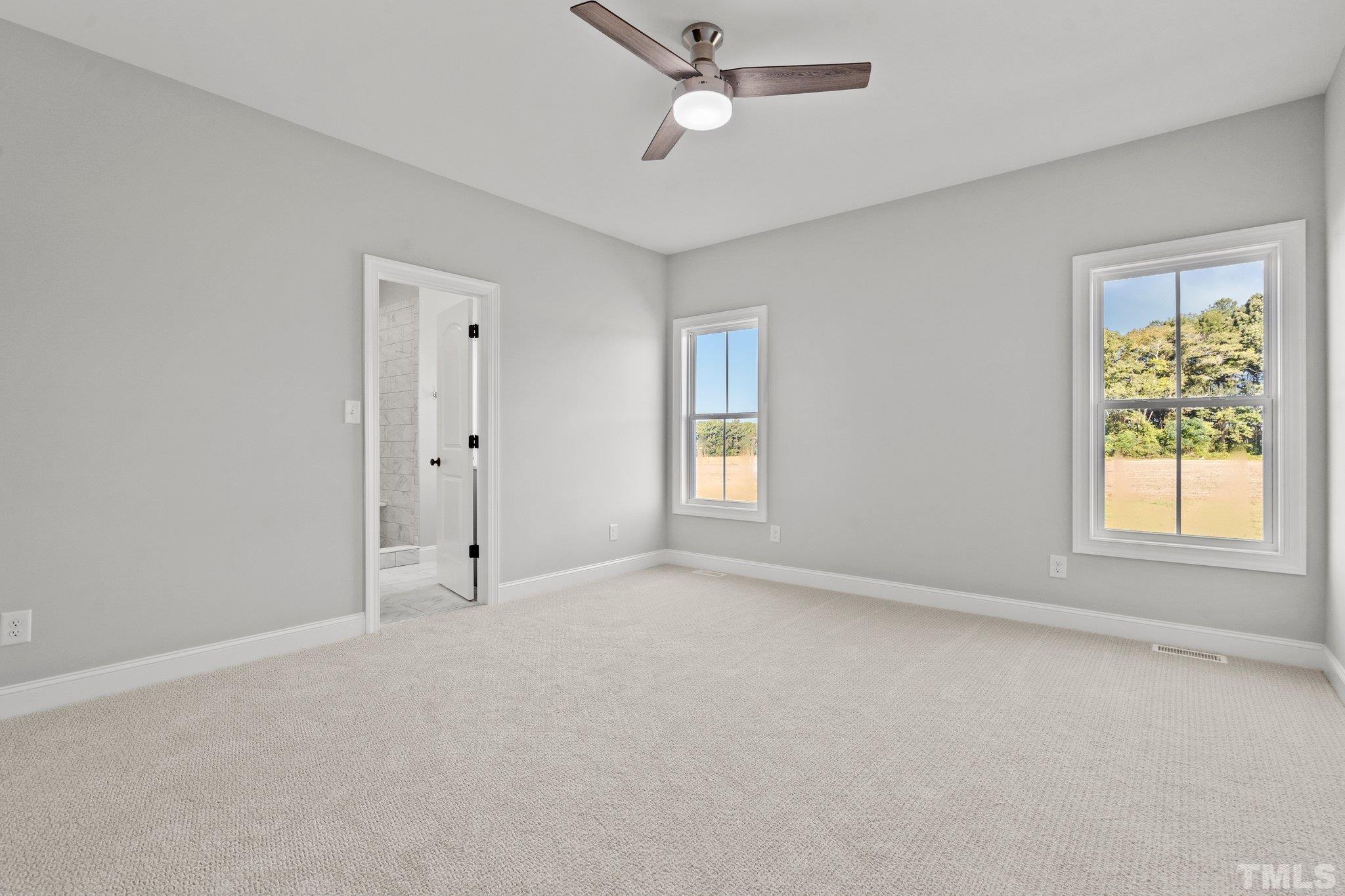 5901 Harvest Rdg Road Battleboro, NC 27809 - Photo 30 of 33 an empty room with windows and fan
