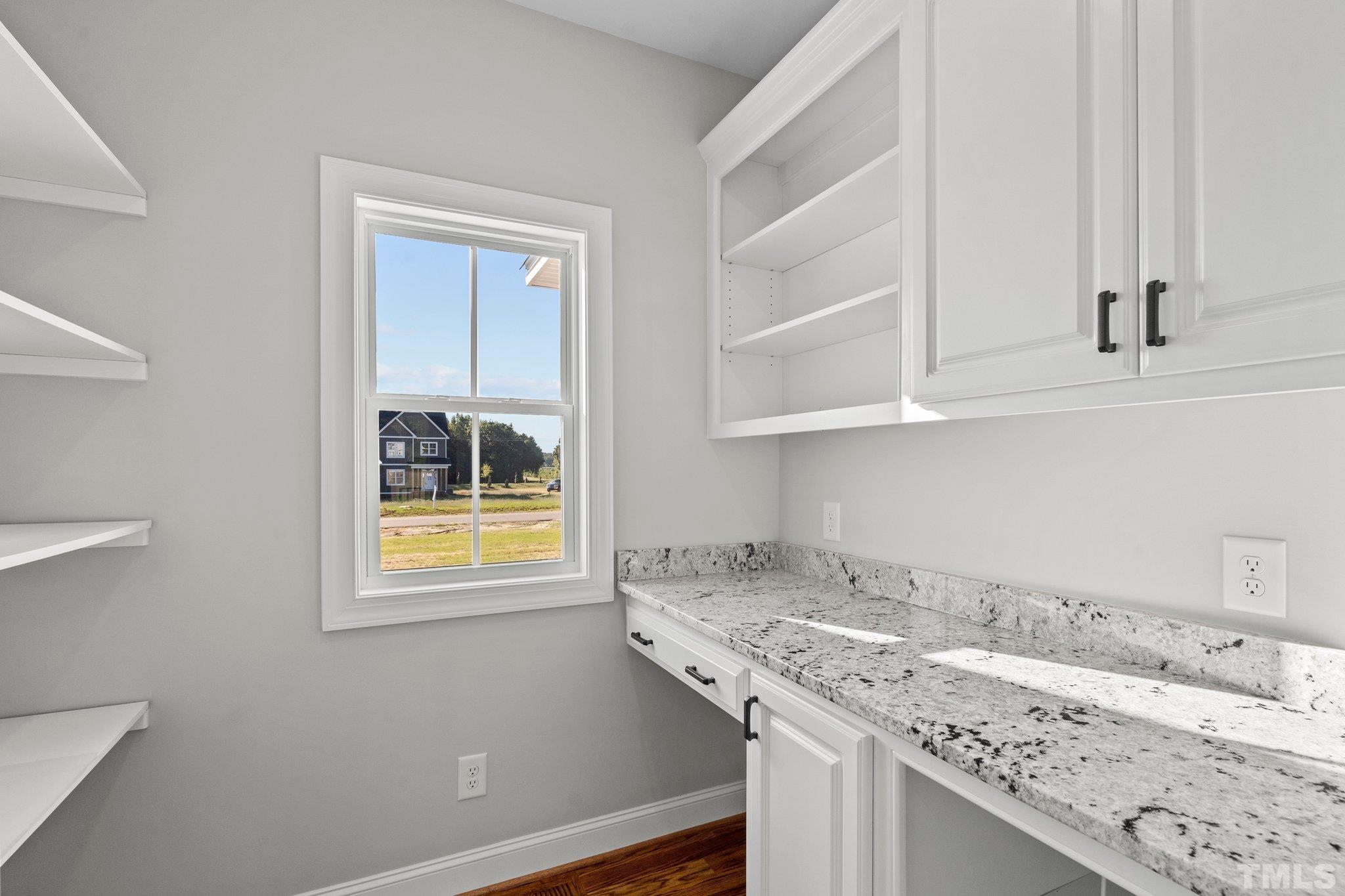 5901 Harvest Rdg Road Battleboro, NC 27809 - Photo 10 of 33 a bathroom with a granite countertop sink and a window