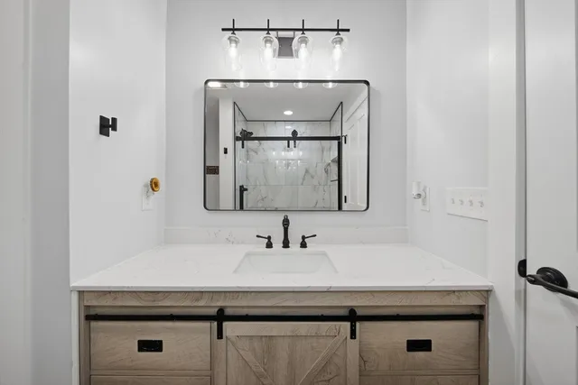 a bathroom with a sink and a mirror