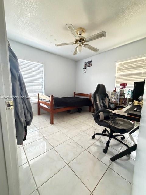 9770 Southwest 210th Street Cutler Bay, FL 33189 - Photo 16 of 32 a view of a workspace with furniture and a window