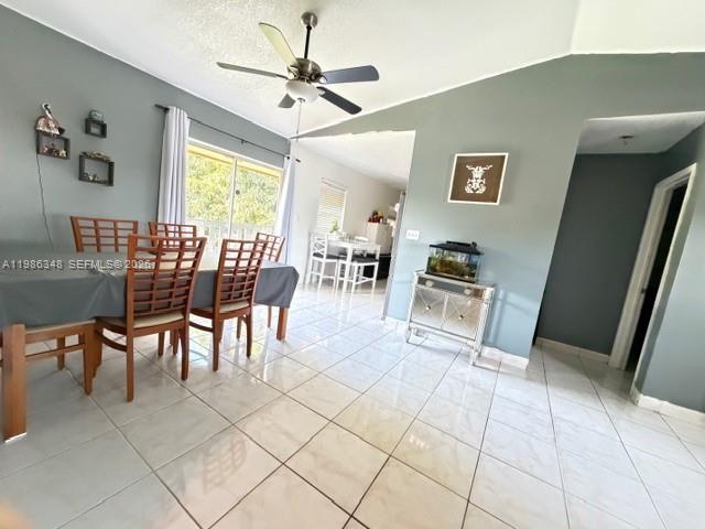 9770 Southwest 210th Street Cutler Bay, FL 33189 - Photo 18 of 32 a dining room with furniture and window