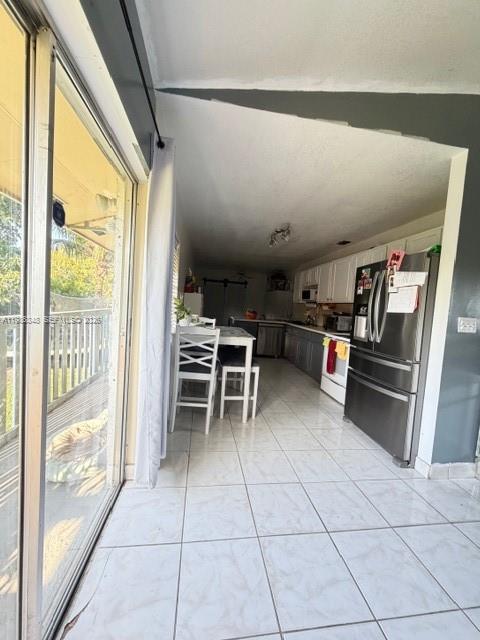 9770 Southwest 210th Street Cutler Bay, FL 33189 - Photo 20 of 32 a open kitchen with cabinets and stainless steel appliances