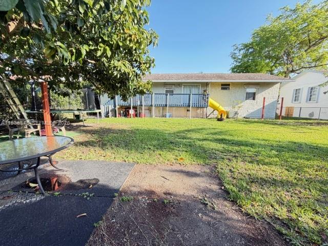 9770 Southwest 210th Street Cutler Bay, FL 33189 - Photo 28 of 32 a view of a house with backyard and trees