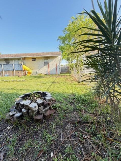 9770 Southwest 210th Street Cutler Bay, FL 33189 - Photo 31 of 32 a view of a house with a yard