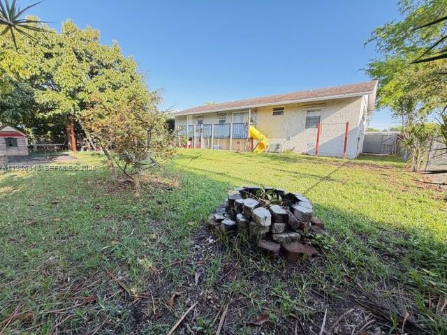 9770 Southwest 210th Street Cutler Bay, FL 33189 - Photo 32 of 32 a view of a house with a back yard