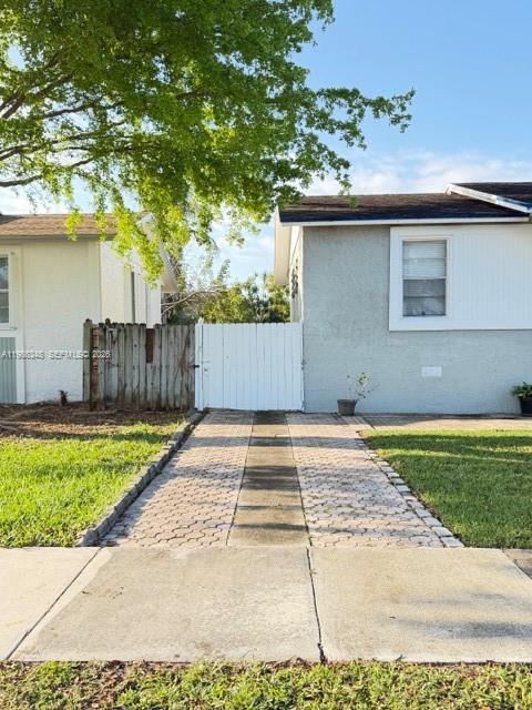 9770 Southwest 210th Street Cutler Bay, FL 33189 - Photo 5 of 32 front view of a house with a yard