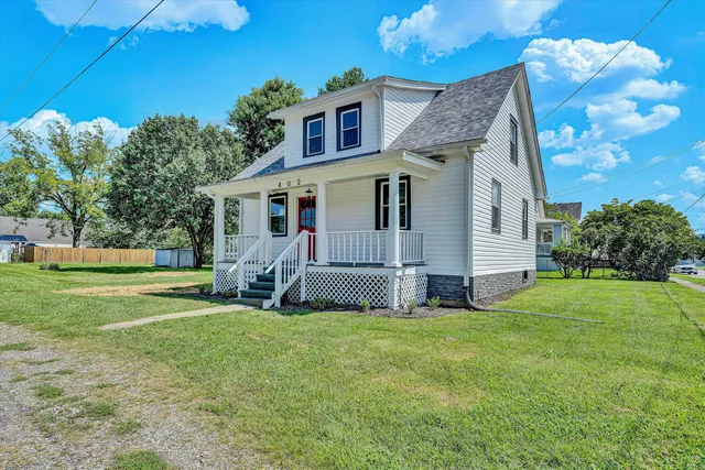 a view of a house with a yard