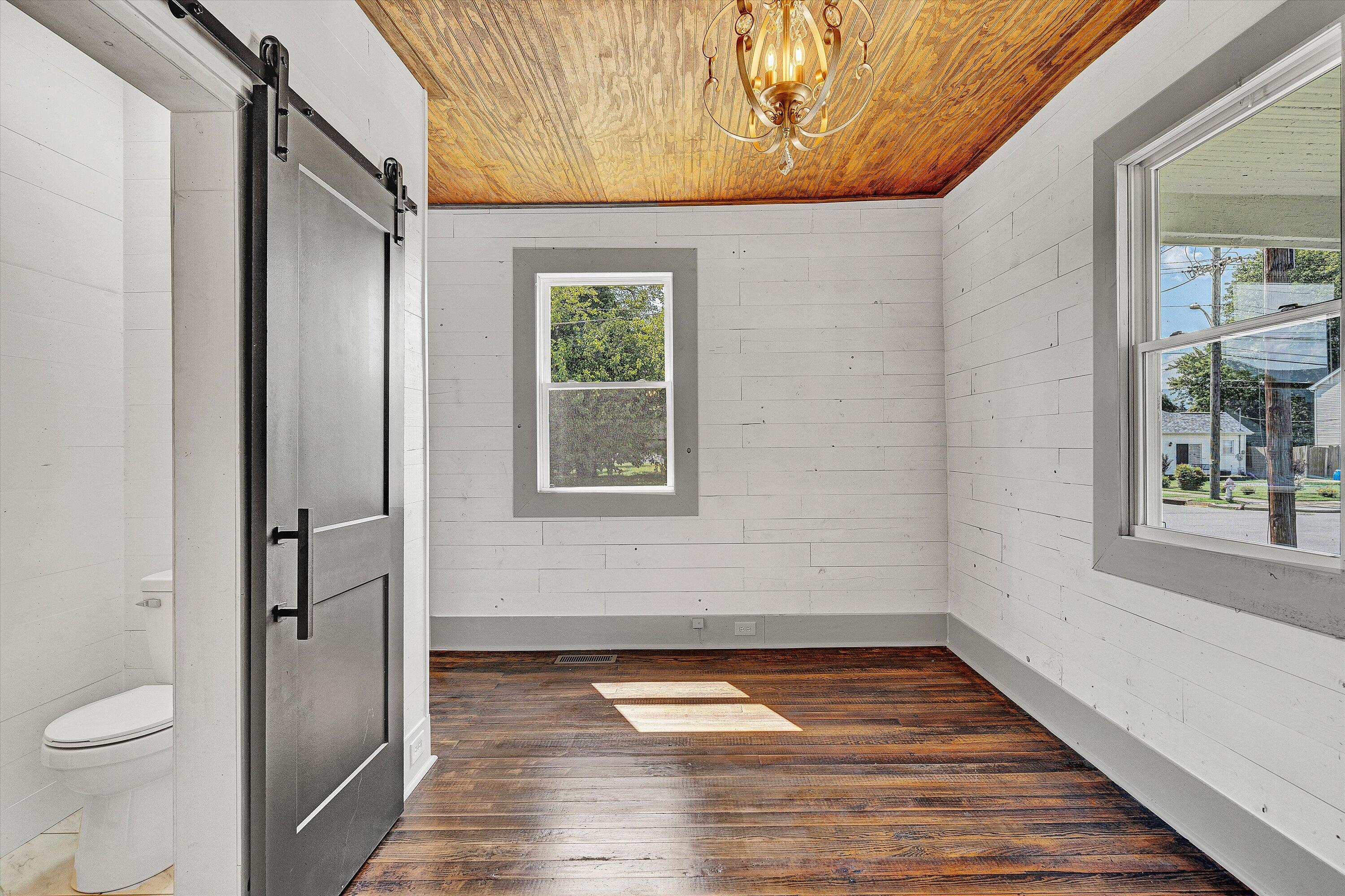 402 7th Street Salem, VA 24153 - Photo 13 of 32 a bathroom with a toilet and a shower