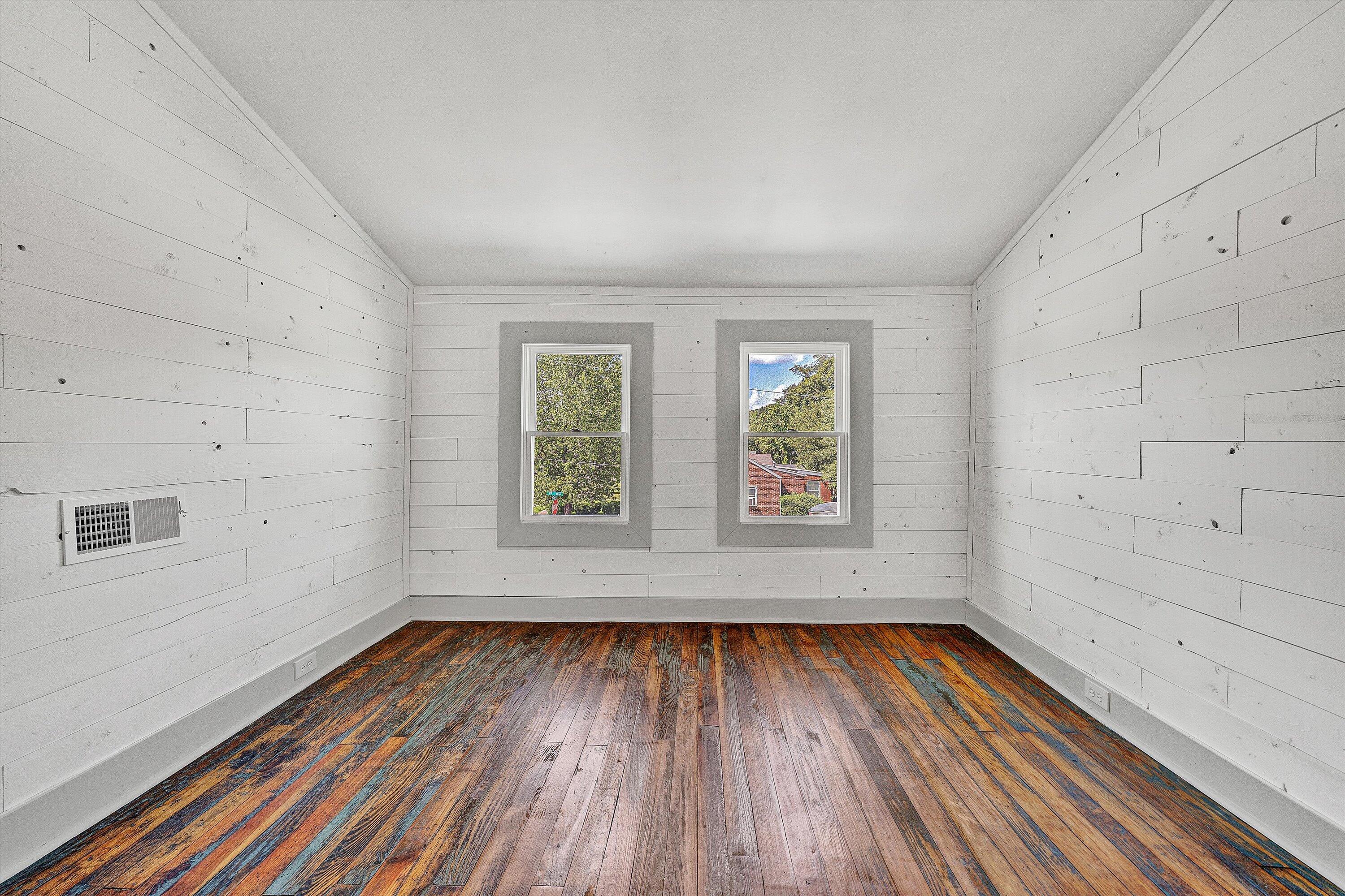 402 7th Street Salem, VA 24153 - Photo 25 of 32 wooden floor in an empty room with a window