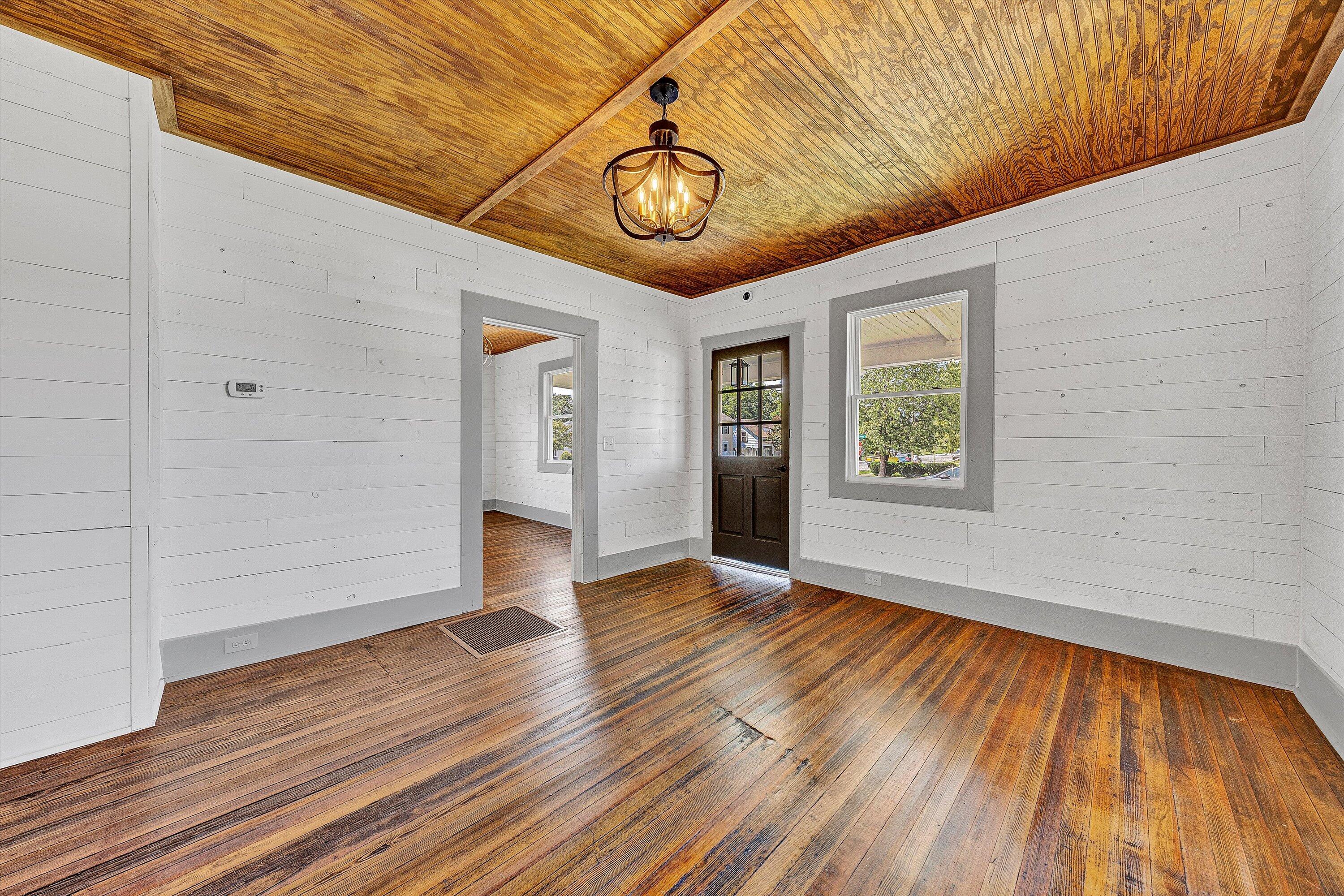 402 7th Street Salem, VA 24153 - Photo 4 of 32 a view of an empty room with window and wooden floor