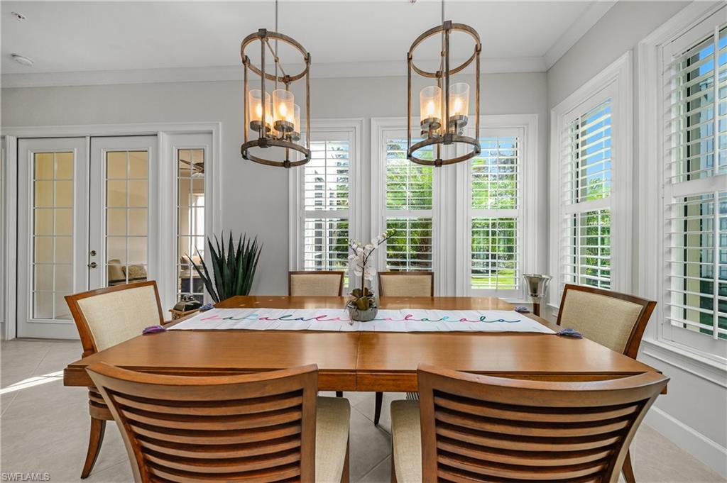 6552 Dominica Drive, Unit 101 Naples, FL 34113 - Photo 12 of 50 a dining room with furniture and window