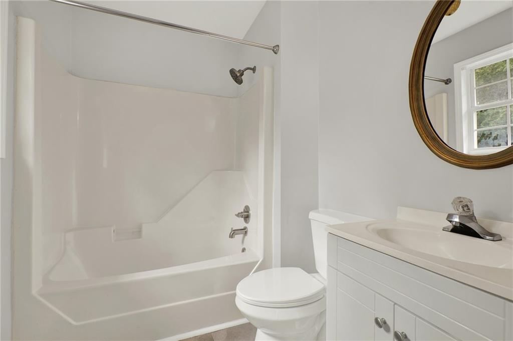 76 Picklesimer Road Southwest Cartersville, GA 30120 - Photo 28 of 43 a bathroom with a sink a toilet and a bathtub