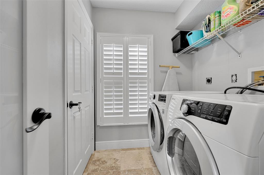 3588 Sahara Springs Boulevard Pompano Beach, FL 33069 - Photo 14 of 41 a utility room with dryer and washer