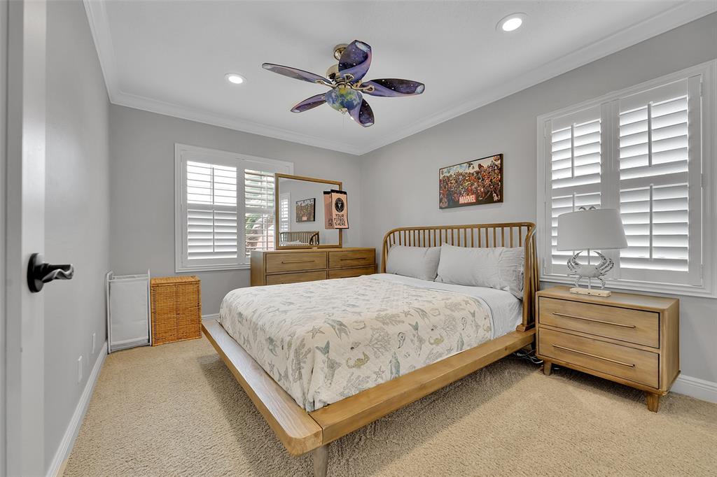 3588 Sahara Springs Boulevard Pompano Beach, FL 33069 - Photo 18 of 41 a bedroom with a bed and window