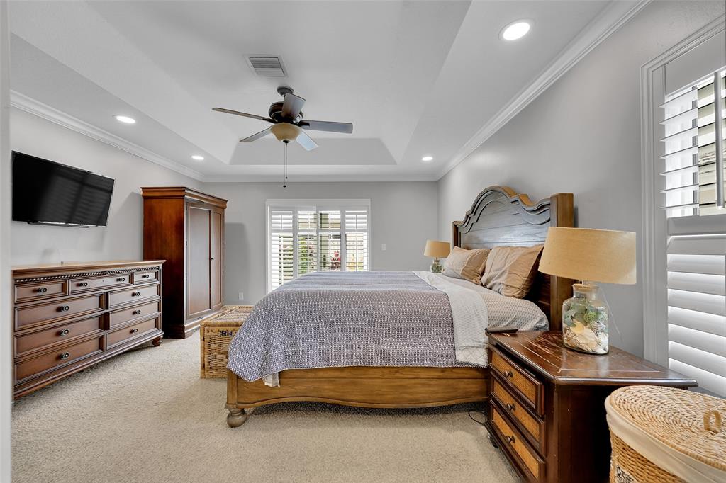 3588 Sahara Springs Boulevard Pompano Beach, FL 33069 - Photo 21 of 41 a bedroom with a bed and a flat screen tv