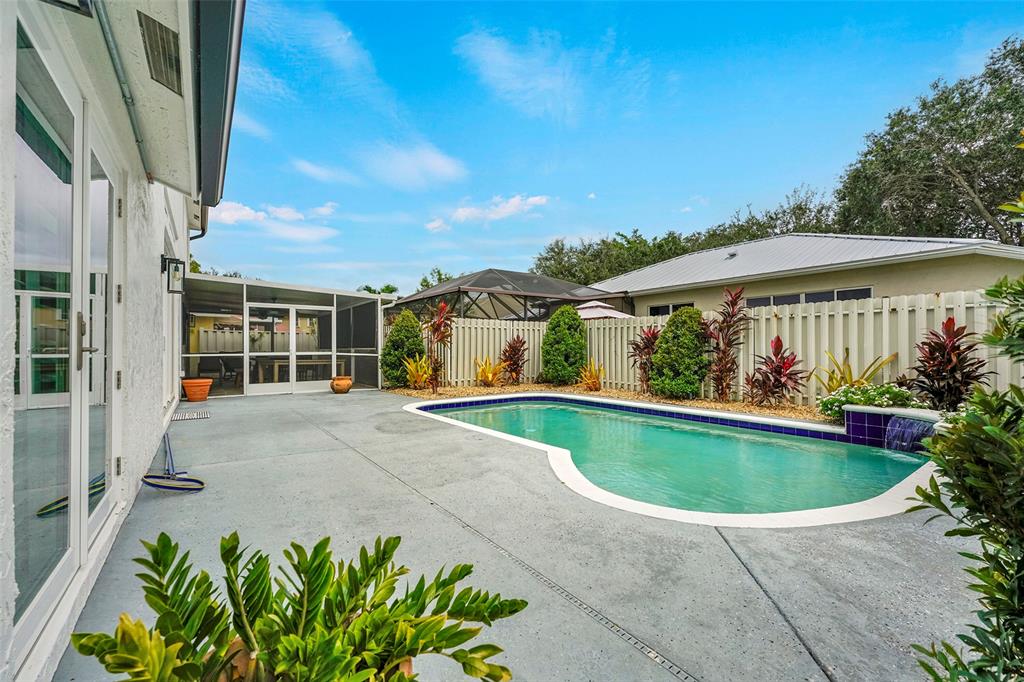3588 Sahara Springs Boulevard Pompano Beach, FL 33069 - Photo 28 of 41 a view of a house with a swimming pool