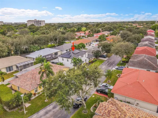 an aerial view of residential houses with outdoor space