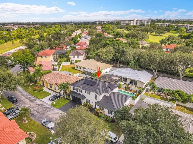 an aerial view of residential houses with outdoor space