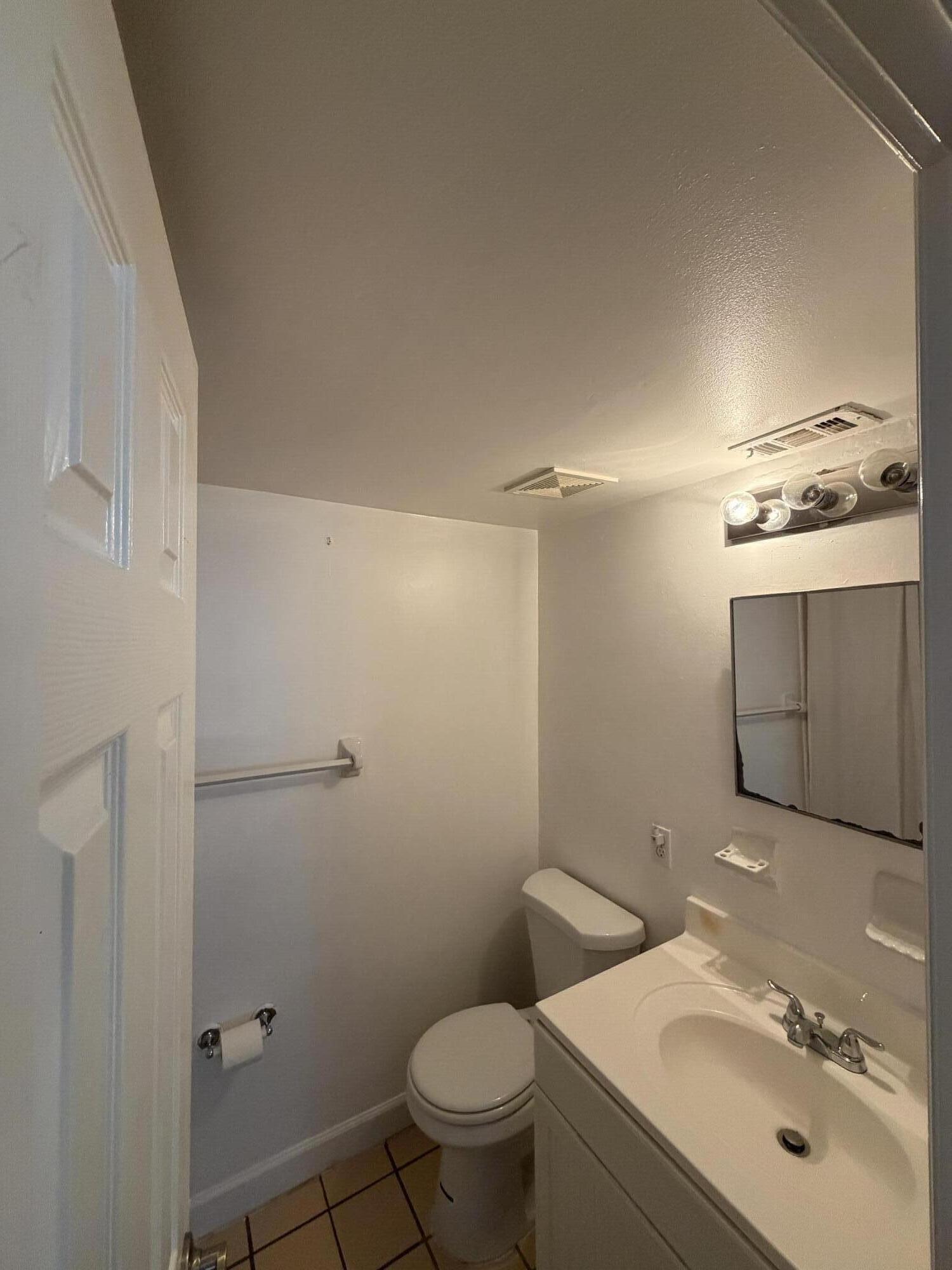 270 South Cypress Road, Unit 204 Pompano Beach, FL 33060 - Photo 11 of 14 a bathroom with a sink toilet and shower