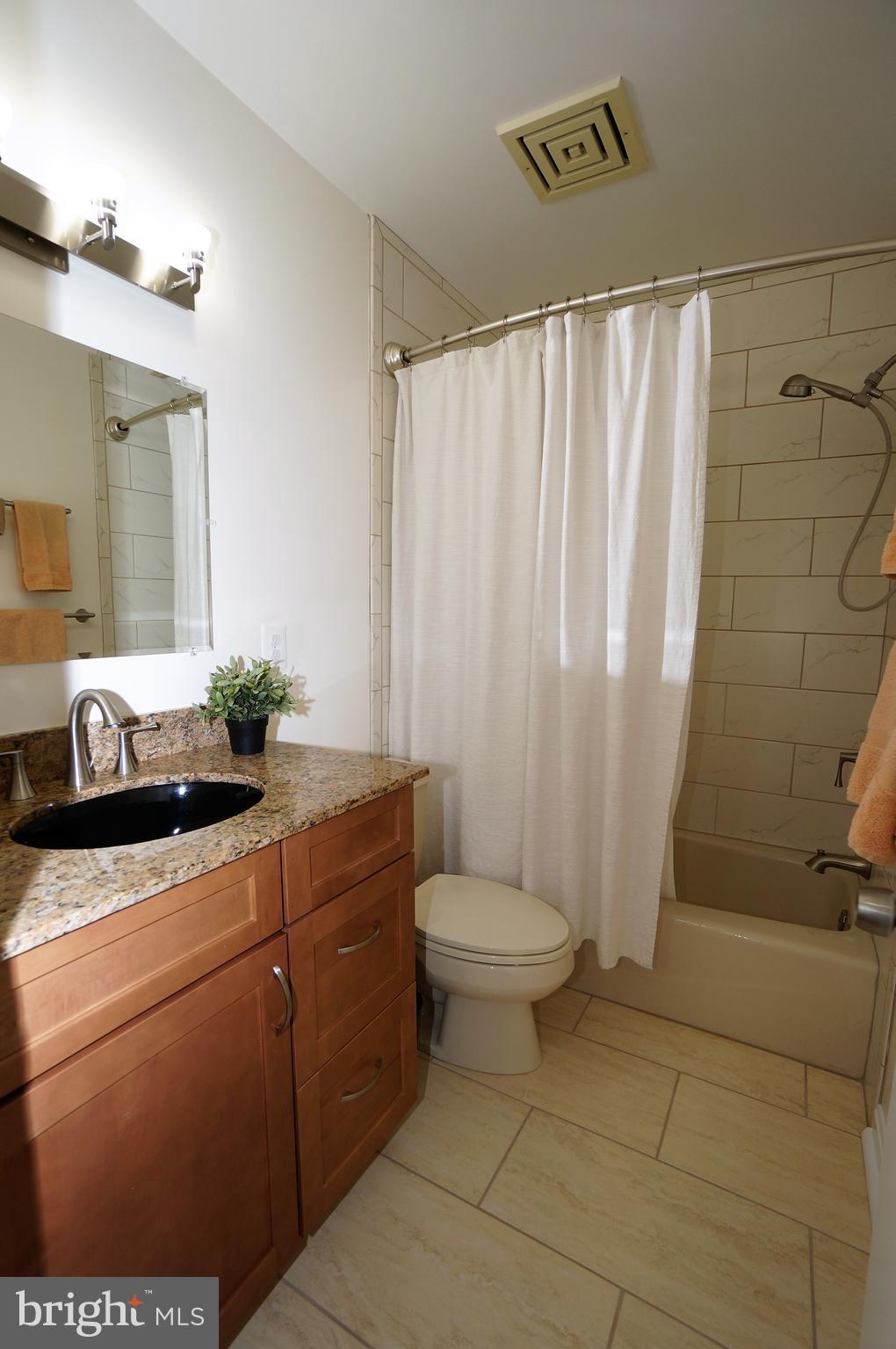 2000 Edgewater Parkway Silver Spring, MD 20903 - Photo 21 of 29 Remodeled Hall Bath with Granite & Maple