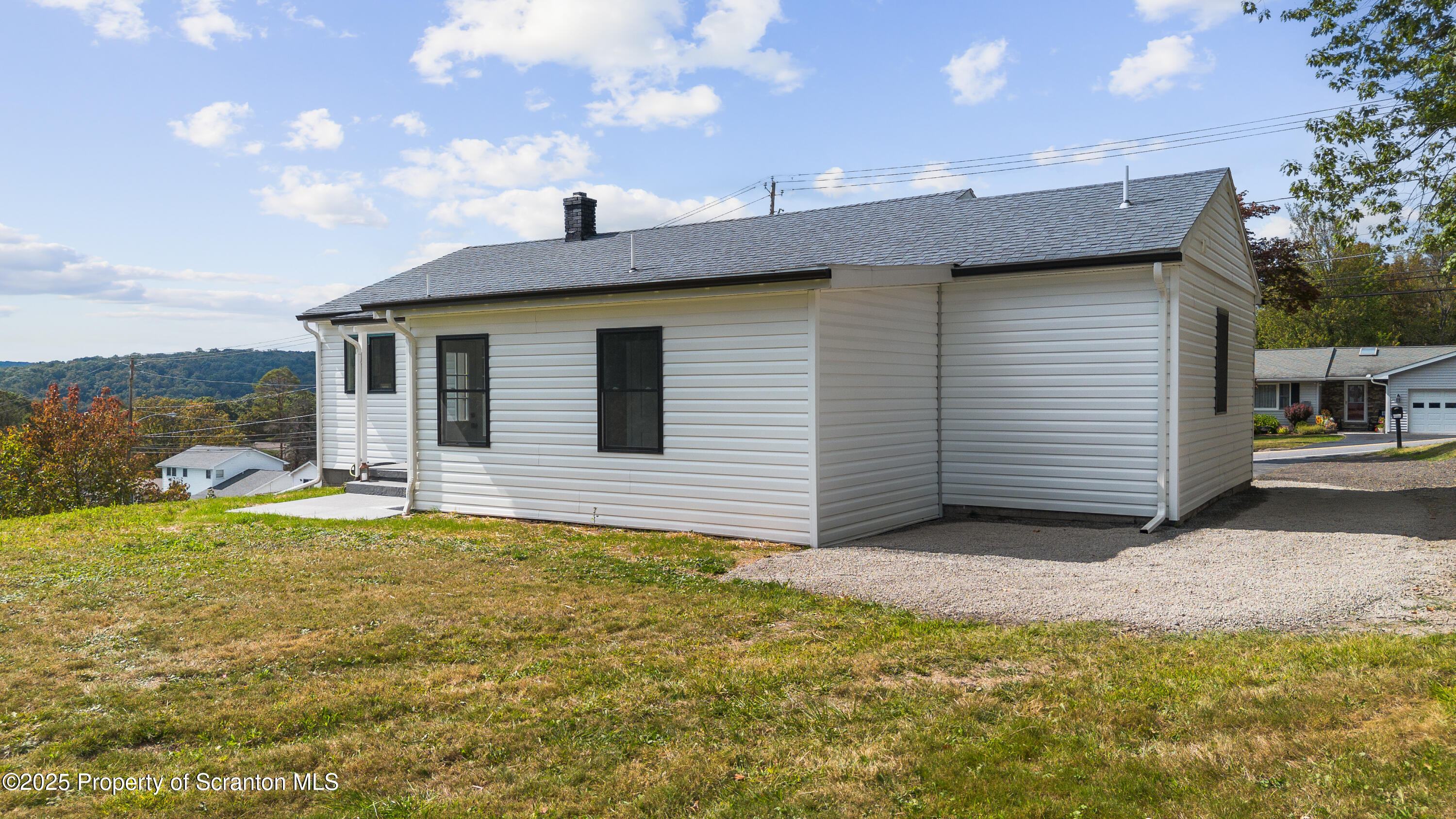 630 Layton Road Clarks Summit, PA 18411 - Photo 11 of 58 a view of a house with a yard