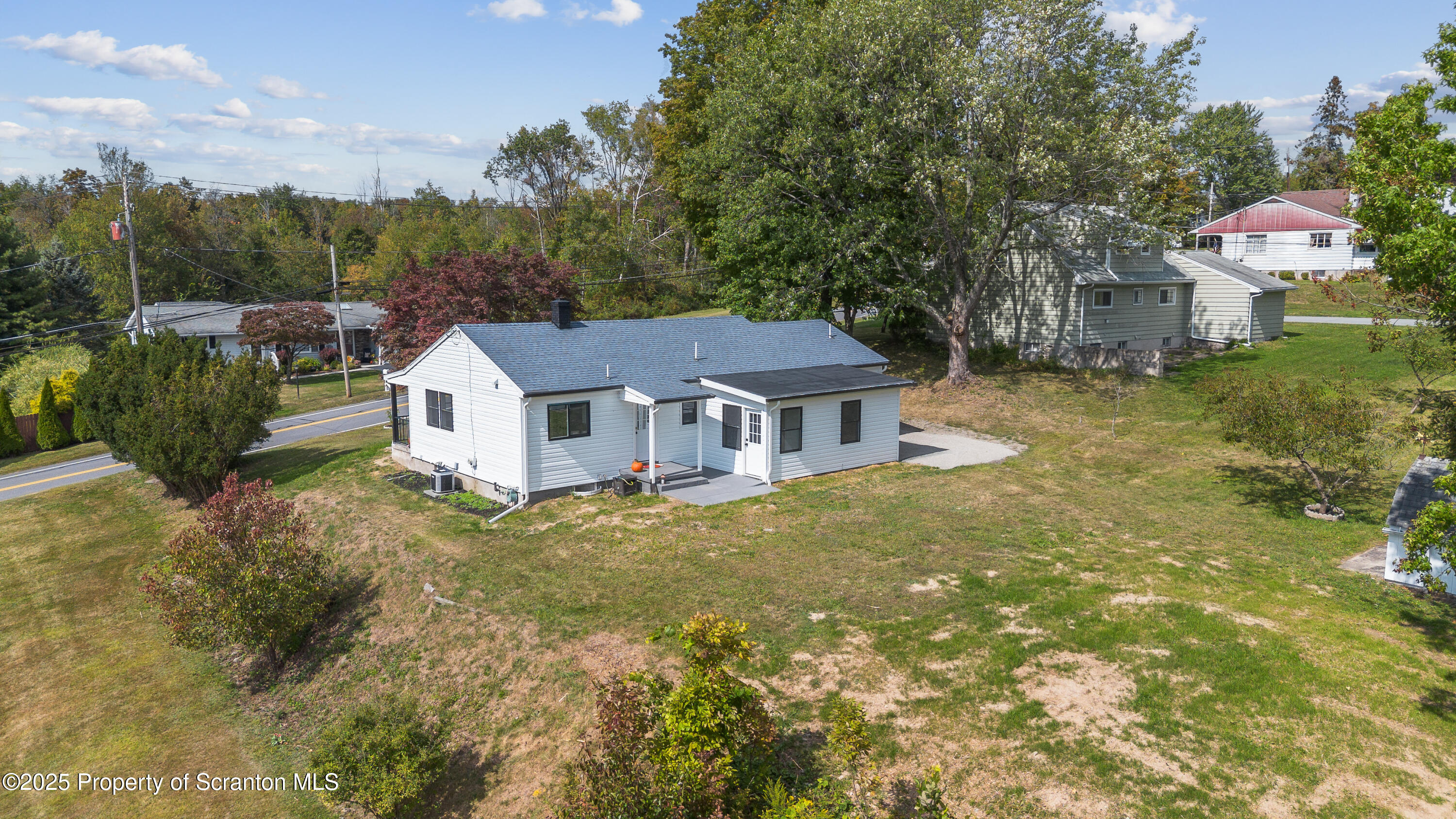 630 Layton Road Clarks Summit, PA 18411 - Photo 14 of 58 a front view of a house with garden