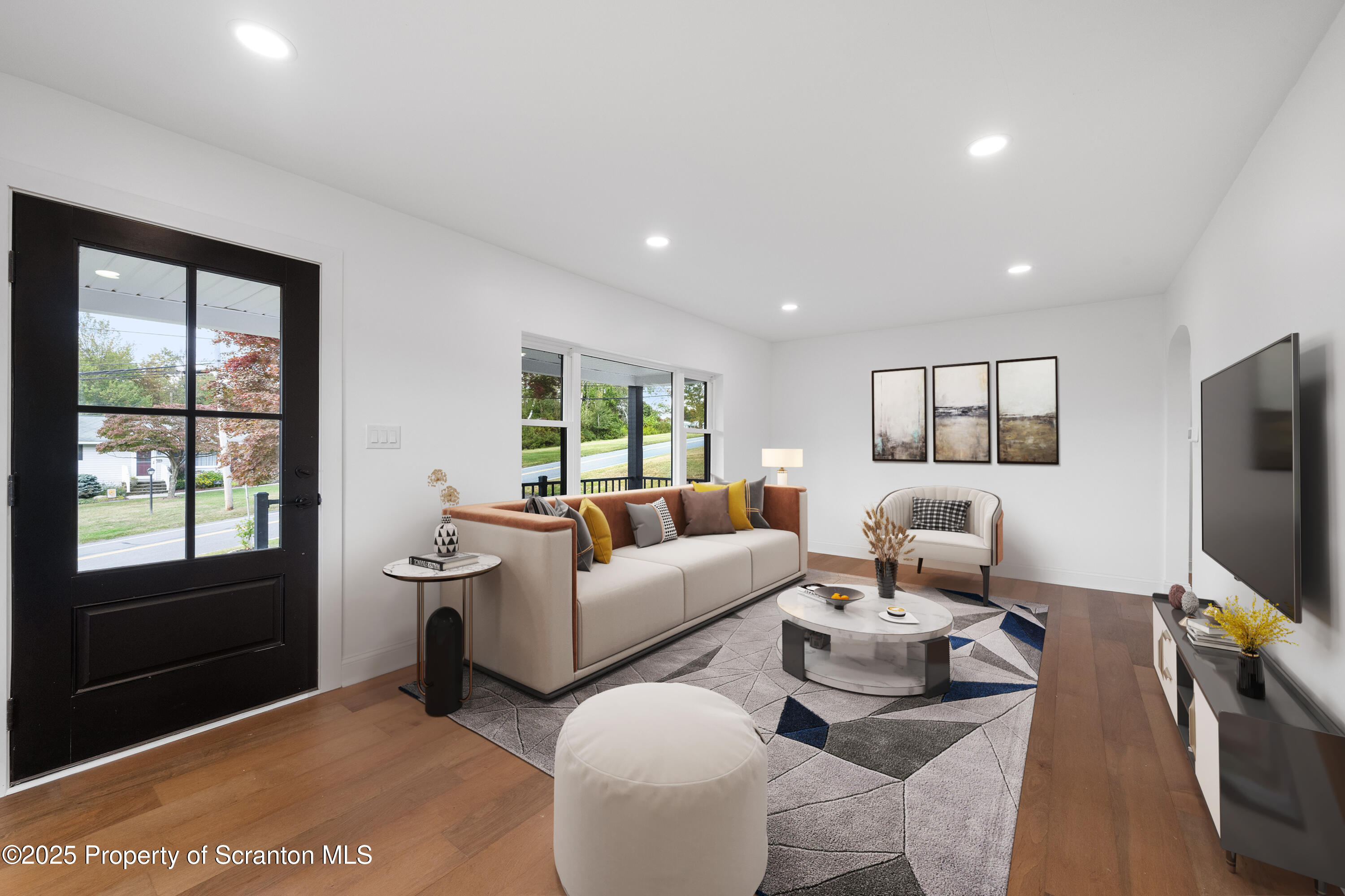 630 Layton Road Clarks Summit, PA 18411 - Photo 18 of 58 a living room with furniture a flat screen tv and a window