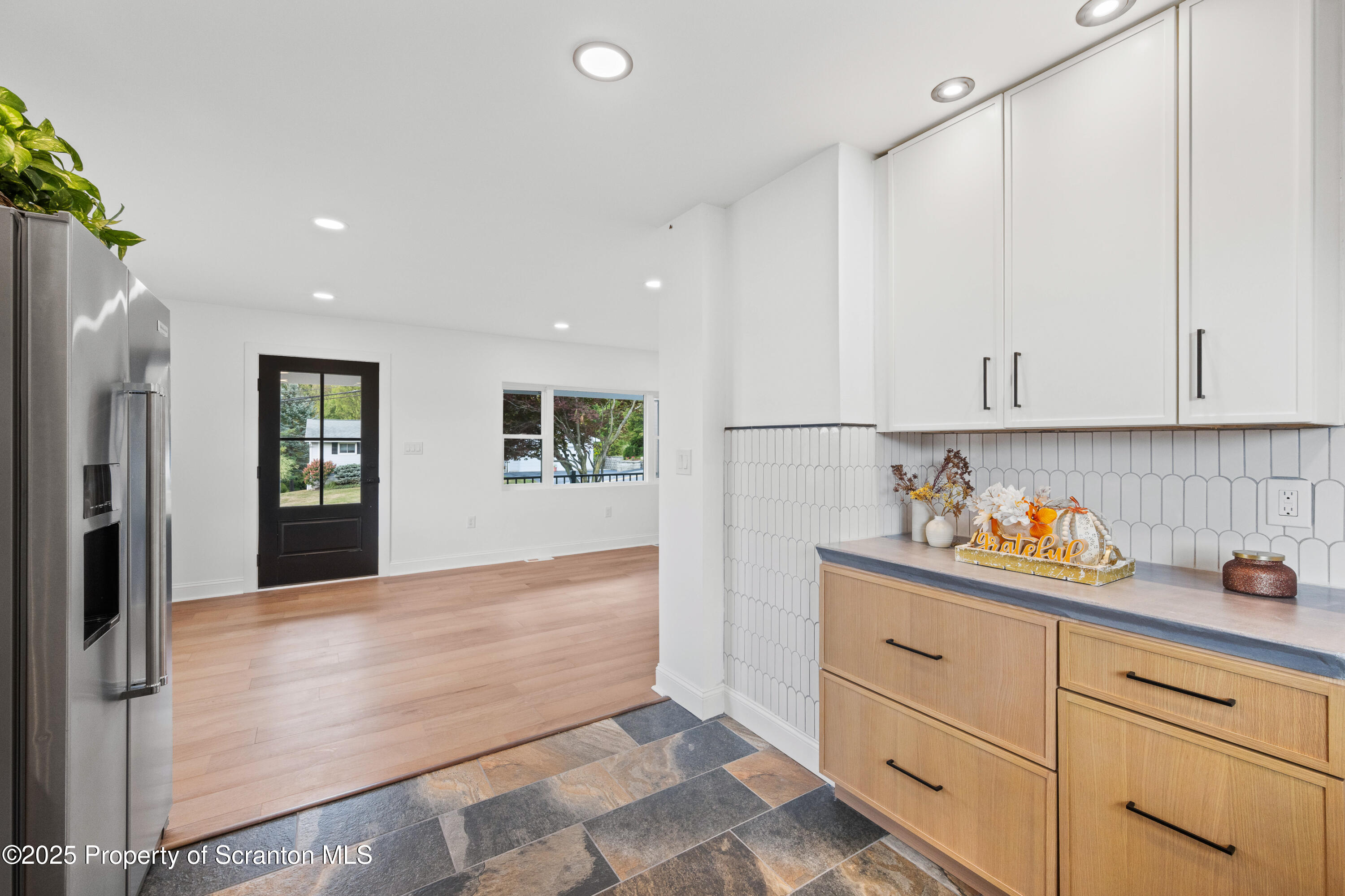 630 Layton Road Clarks Summit, PA 18411 - Photo 23 of 58 a kitchen with granite countertop white cabinets and stainless steel appliances